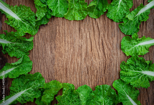 Bio food. green Lettuce leaves pattern on old wooden background, copy space for text.