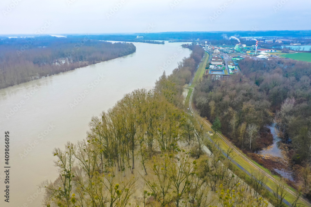 Drone photography of the flooded floodplains of the german Rhine River near Wörth, Maxau. Flood disaster in winter.