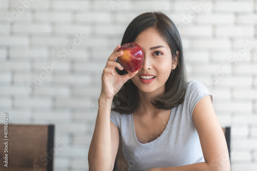 young Asian woman smiling t...