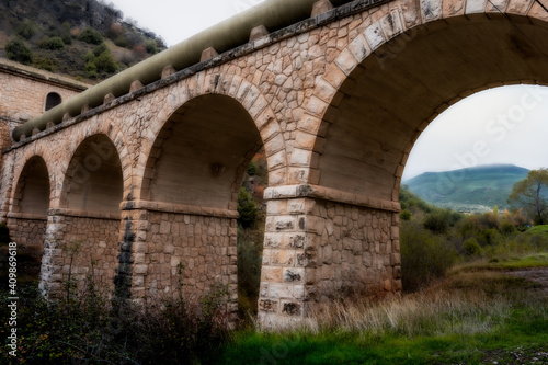 Bridge to transport water in a town between mountains © Javi