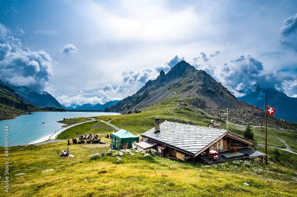 Panoramic view on house, mountains and lake Panoramic view on house, mountains and lake