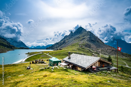 Panoramic view on house, mountains and lake