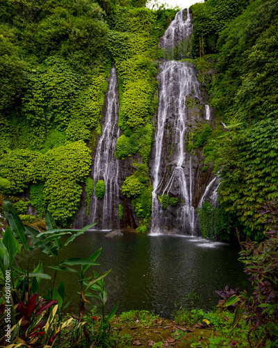 Waterfall scenery. Tropical landscape. Nature background. Adventure and travel concept. Natural environment. Slow shutter speed  motion photography. Banyumala waterfall  Bali