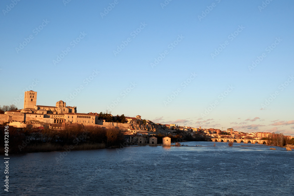 Horizontal view of the cathedral of Zamora at sunset with the Duero River Horizontal view of the cathedral of Zamora at sunset with the Duero River
