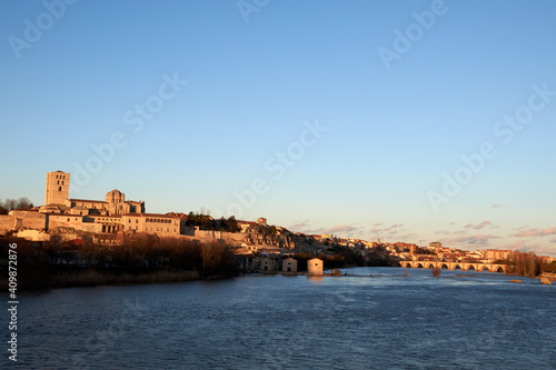 Horizontal view of the cathedral of Zamora at sunset with the Duero River