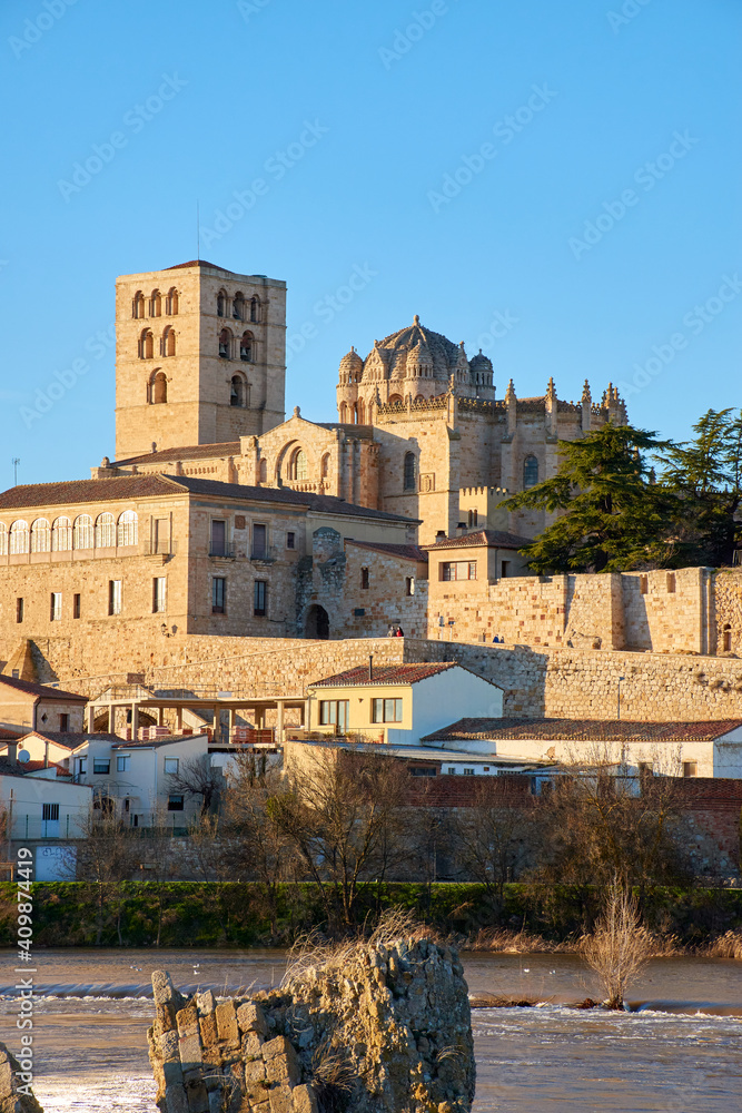 Vertical view of the cathedral of Zamora at sunset with the Duero River