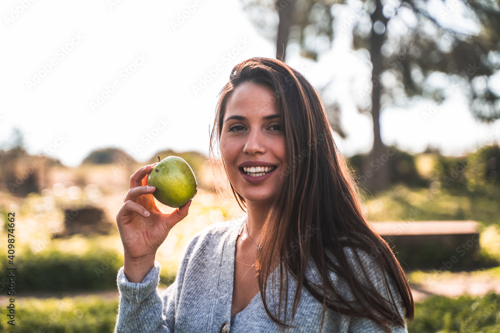 girl eat apple in nature