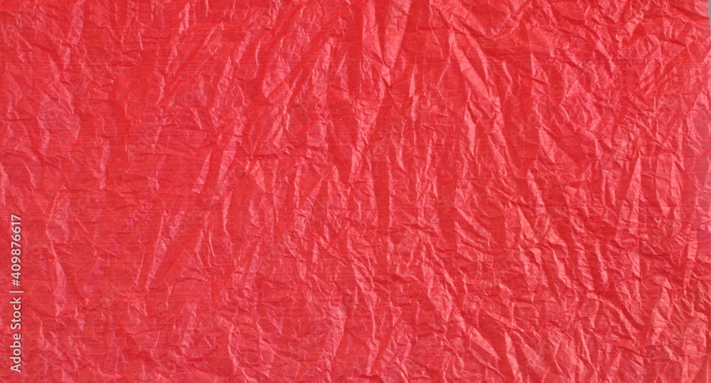 Obraz premium Red bright crumpled textured paper background