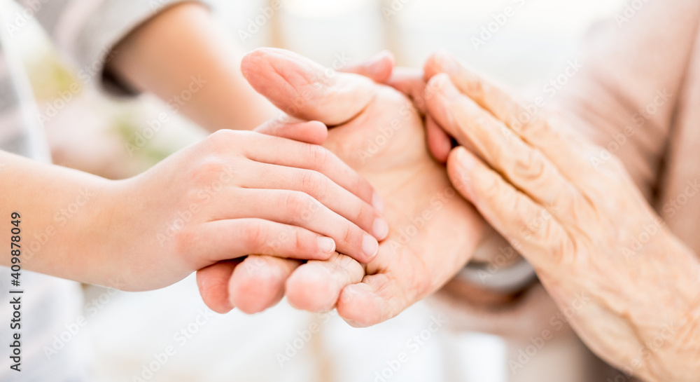 Interweaving of young and old hands on light background Interweaving of young and old hands on light background