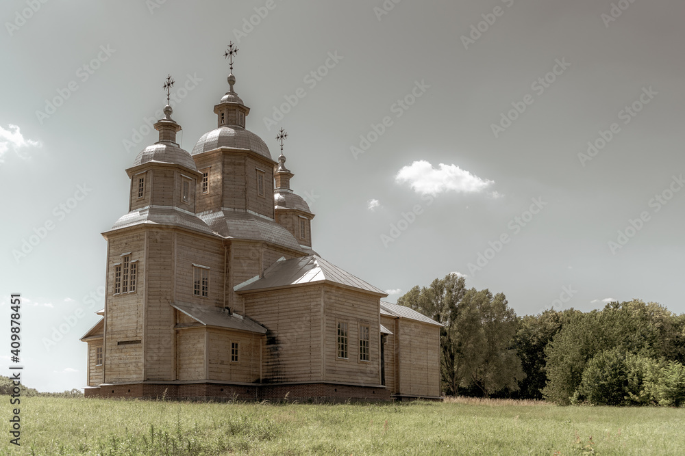 An old Orthodox Ukrainian church. Wooden structure. Old photo.