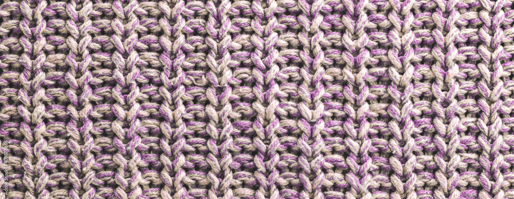 Texture background of purple knitted fabric sweaters, macro textile banner and background, cozy home pattern