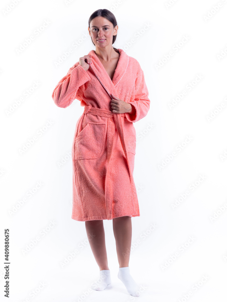 woman in a Bathrobe on an isolated white background with a smile on her face. woman in a Bathrobe on an isolated white background with a smile on her face.