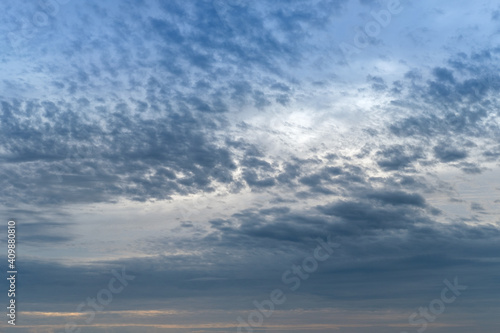 sunset with blue fluffy cloudy sky, sunset background