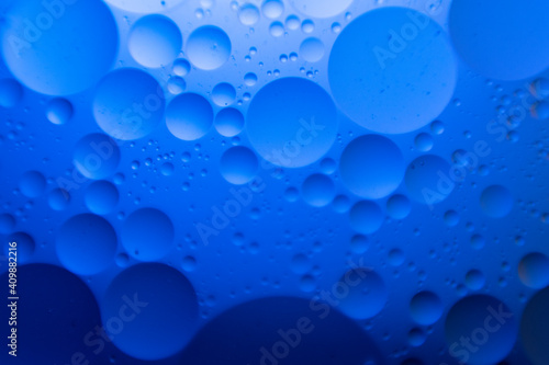macro oil water photography Abstract background and texture of bubbles light multi color illumination.  art water surface for your products display and artwork design with copy space. Watery glare 