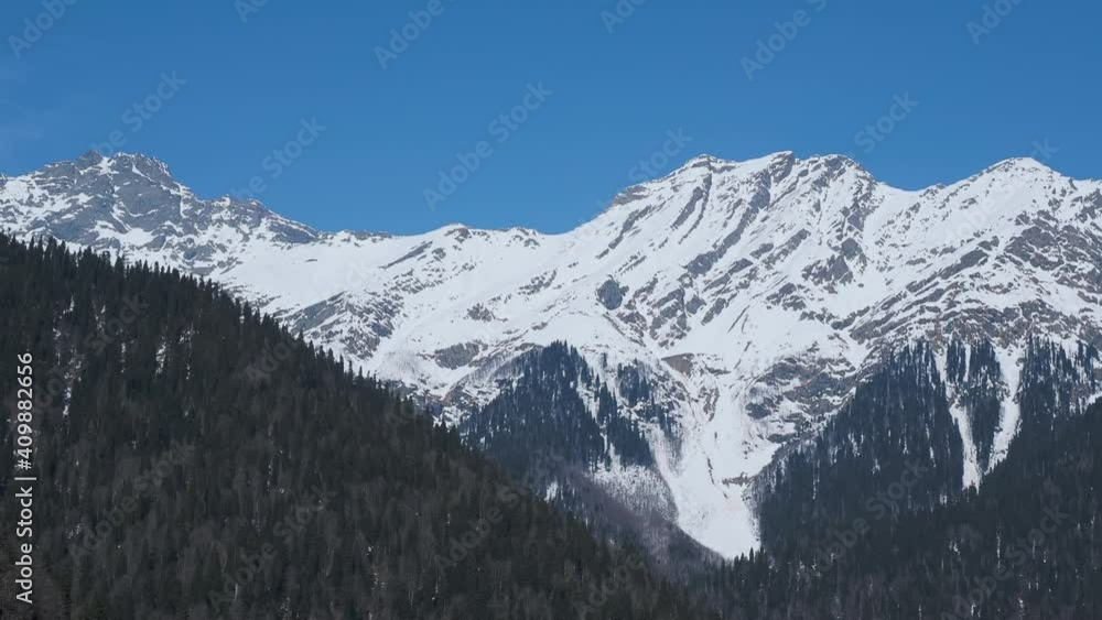 Panoramic view of mountains over Ritsa lake in Abkhazia. Famous landmark between mountain radge. Panoramic view of mountains over Ritsa lake in Abkhazia. Famous landmark between mountain radge.