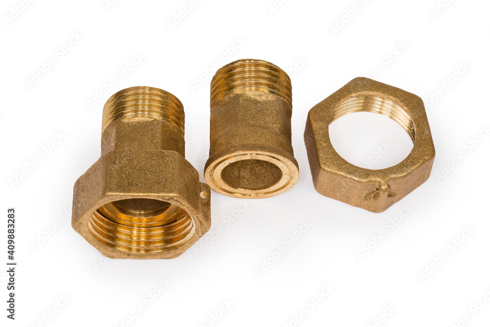 Brass threaded plumbing connections with nuts on a white background Brass threaded plumbing connections with nuts on a white background