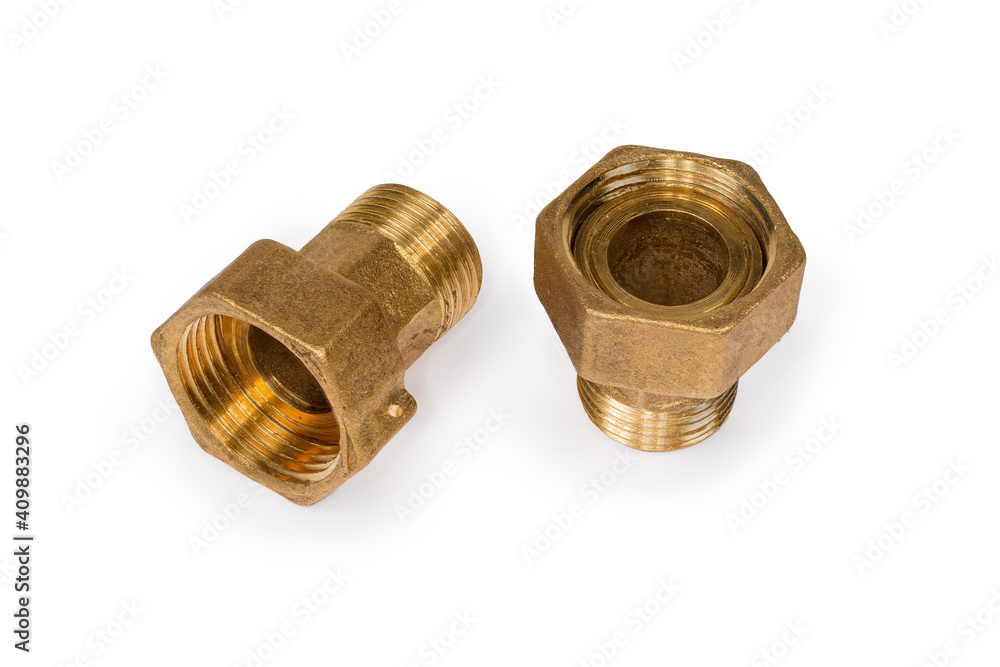 Brass threaded plumbing connections with nuts on a white background Brass threaded plumbing connections with nuts on a white background