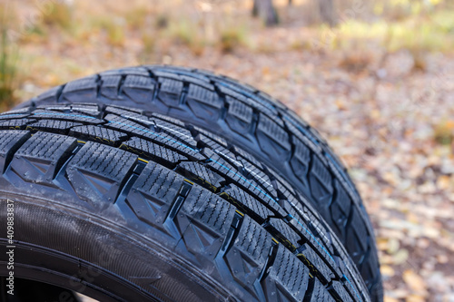 Fragment of the aggressive tread of car tires, selective focus