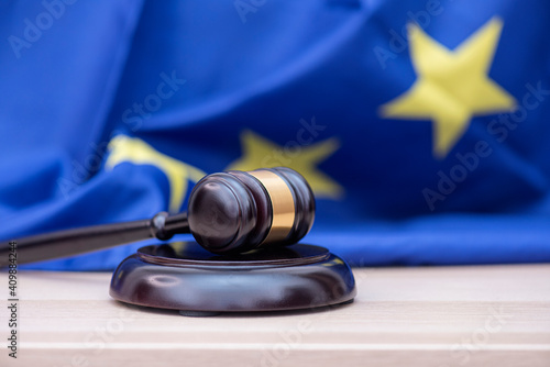 Flag of European Union and judges wooden gavel on the top, concept picture about court and justice