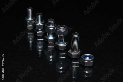 Bolts with nuts on 8mm on black background