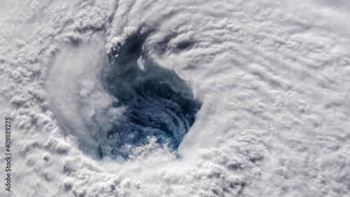 Satellite imagery of a hurricane view from above. Contains public domain image by NASA.