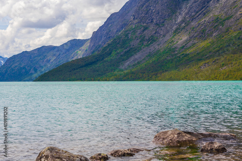 Amazing Besseggen Mountain ridge and turquoise lake landscape in Norway. photo