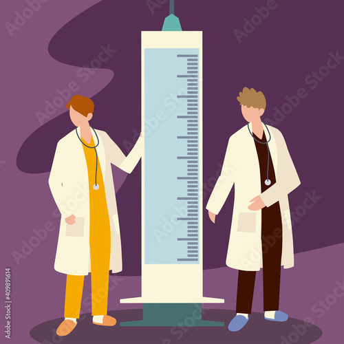 doctors with huge syringe for covid 19 prevention vaccine