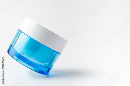 Wallpaper Mural Beauty cosmetic blue color on white background isolated, face care cream, dropper, brush on for healthy make up. Product container design bottles. Skin care products on empty background Torontodigital.ca