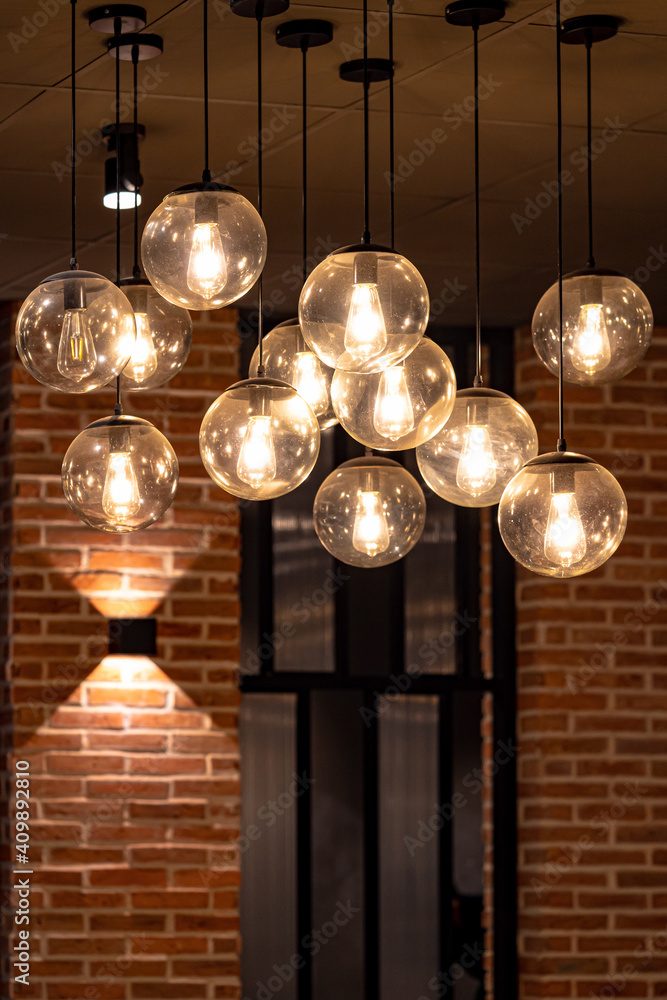 Warm coffee shop view interior with urban style lamp light , desk and chair background Warm coffee shop view interior with urban style lamp light , desk and chair background