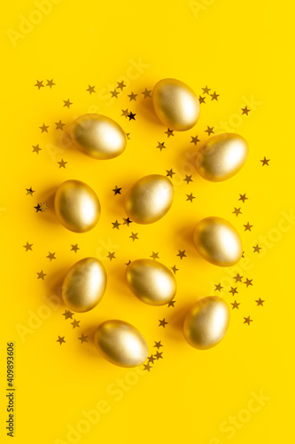 Golden Easter eggs with decoration. Top view