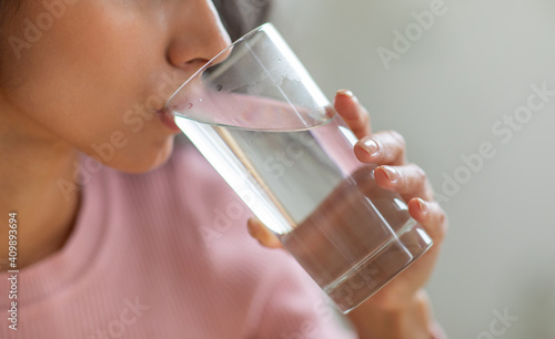 Healthy Liquid. Unrecognizable Young Lady Drinking Mineral Water From Glass At Home,