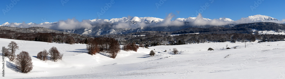 French winter landscapes. Panoramic view of mountain peaks and canyons. Vercors Regional Natural Park.