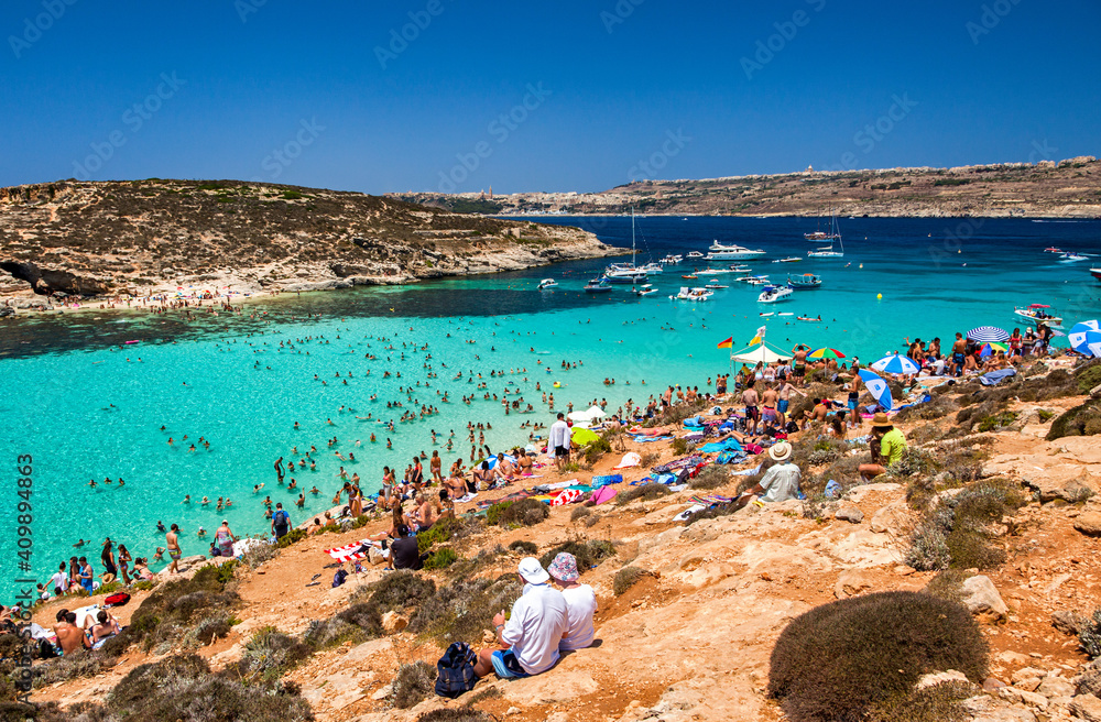 Overcrowded beach at blue lagoon in Comino island, Malta