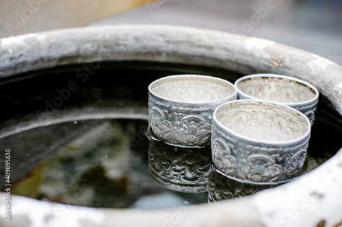 Wallpaper Mural Zinc steel mini cup for watering, tradition container in Thai's people life floating on water Torontodigital.ca