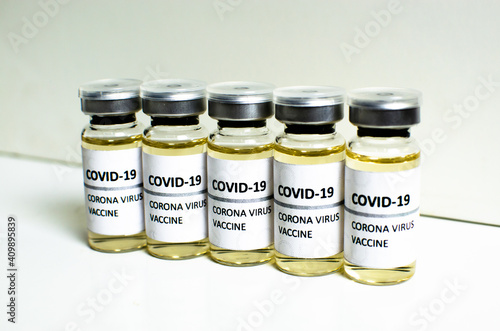 Wallpaper Mural Covid-19 or Coronavirus vaccine in mini medicine bottles on white background, concern disease pharmacy in laboratory and drug to cure people. Healthcare and Medical concept. Development of research. Torontodigital.ca