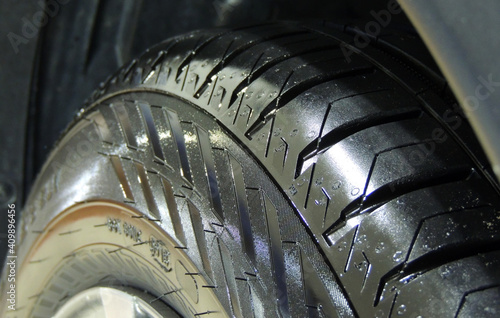 Rubber Of Car Tire After Tire Shine Treatment  photo