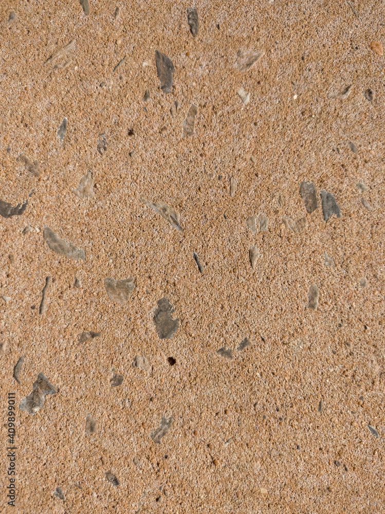Fototapeta premium rough texture orange brown wall with stones