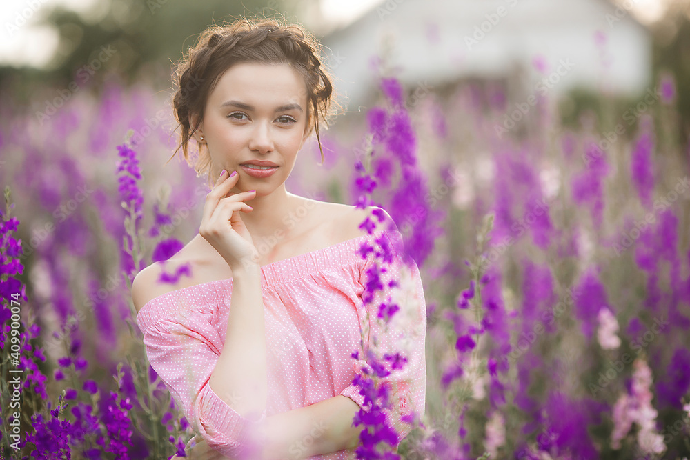 Sexy elegant woman on the meadow of flowers. Beautiful female outdoors. Freedom concept Sexy elegant woman on the meadow of flowers. Beautiful female outdoors. Freedom concept