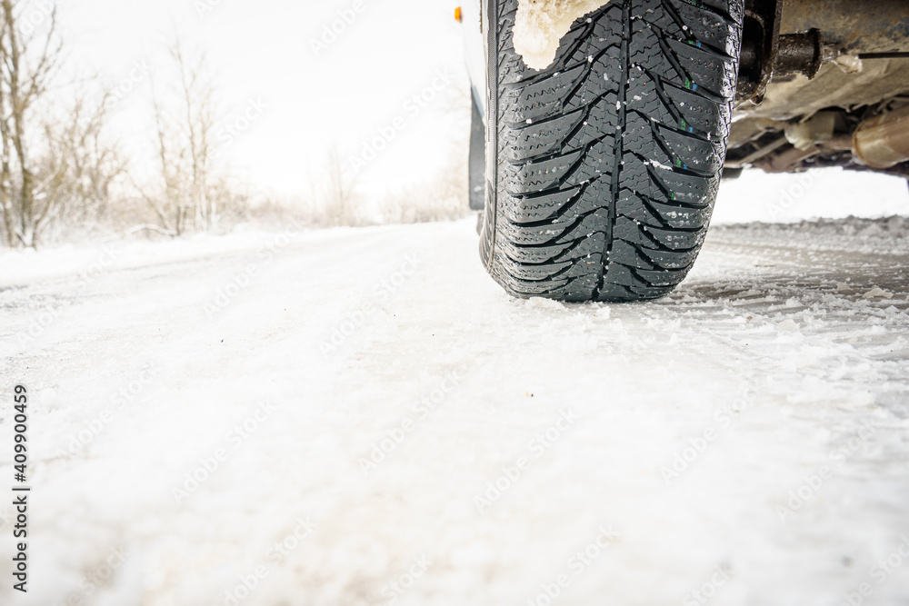 Winter tires on a snowy road.