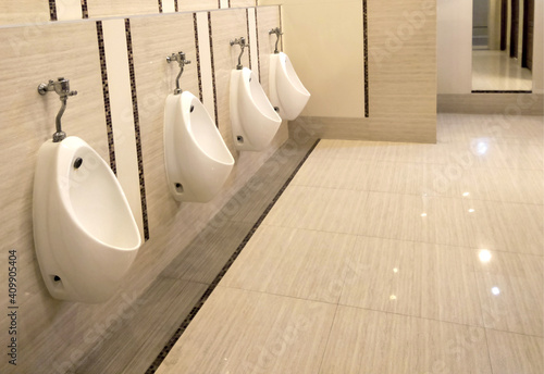 toilet men with row orderly urine bowls and luxury modern style, Interior and design resting room for men