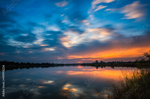 sunset at the lake landscape © songdech17