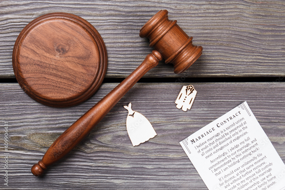 Official marriage concept. Marriage contract with wooden gavel on the table flat lay.