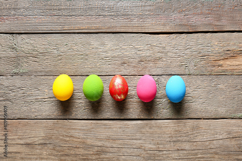 Beautiful Easter eggs on wooden background