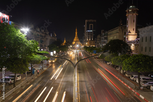Detail of night traffic towards Sule Pagoda Buddhist temple and stupa, from the Sule Paya Road Pedestrian Bridge, in long exposure photography. © Alvaro