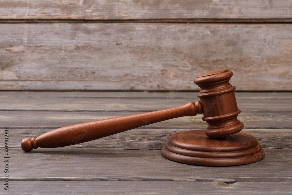 Judges gavel on wooden table. Old grey wood background. Judges gavel on wooden table. Old grey wood background.