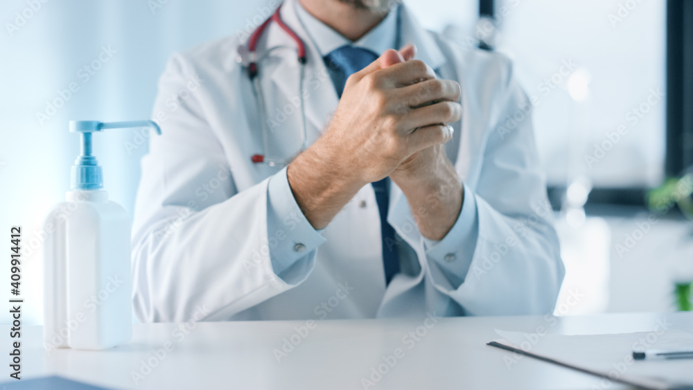 Close Up of Medical Physician is Cleaning Hands with Liquid Hand Sanitizer in a Health Clinic. Doctor Uses Disinfection Soap for Hand Hygiene in Hospital Office. Close Up of Medical Physician is Cleaning Hands with Liquid Hand Sanitizer in a Health Clinic. Doctor Uses Disinfection Soap for Hand Hygiene in Hospital Office.