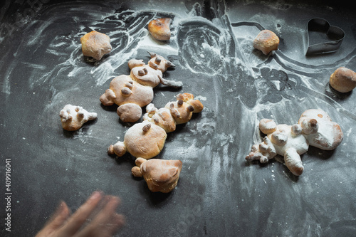 Kids activity with bread dough, baked snowman and other figures 