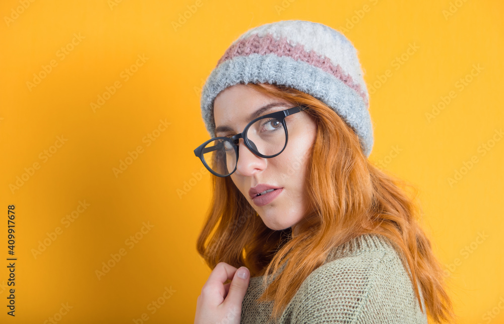 Portrait of a cute young woman, isolated on yellow background. Pretty girl posing. Attractive female looking to camera Portrait of a cute young woman, isolated on yellow background. Pretty girl posing. Attractive female looking to camera