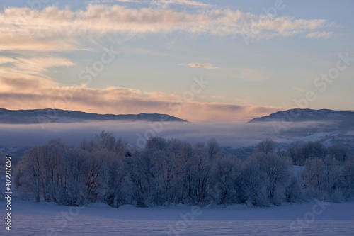 View of the Totenåsen Hills, Norway, seen from the rural lowlands in winter.