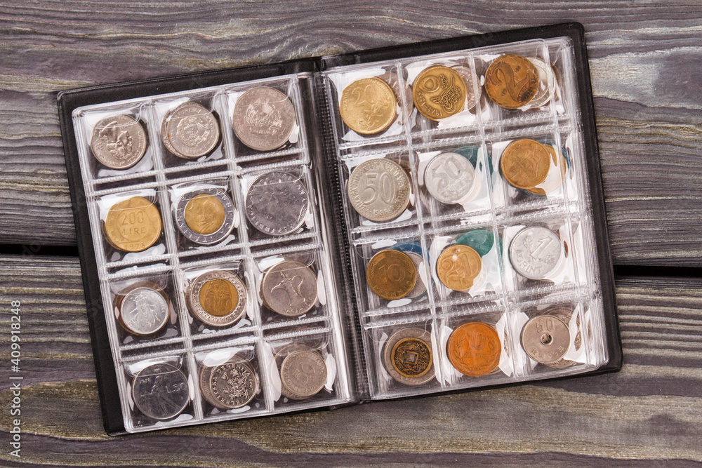 Coins collection on wooden desk. Top view flat lay. Coins collection on wooden desk. Top view flat lay.